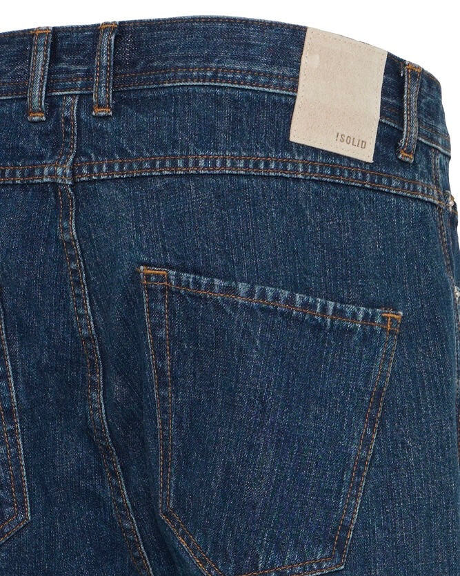 Dettaglio denim e logo ISOLID sul retro